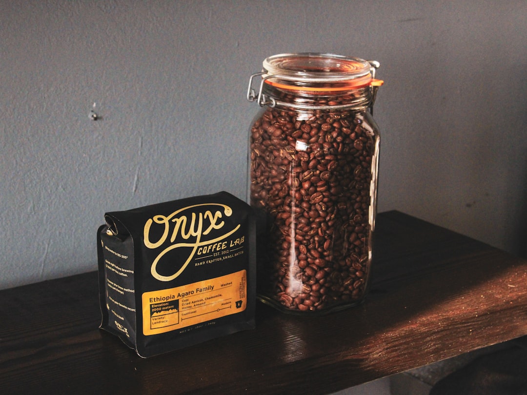 Fresh whole coffee beans stored in airtight container
